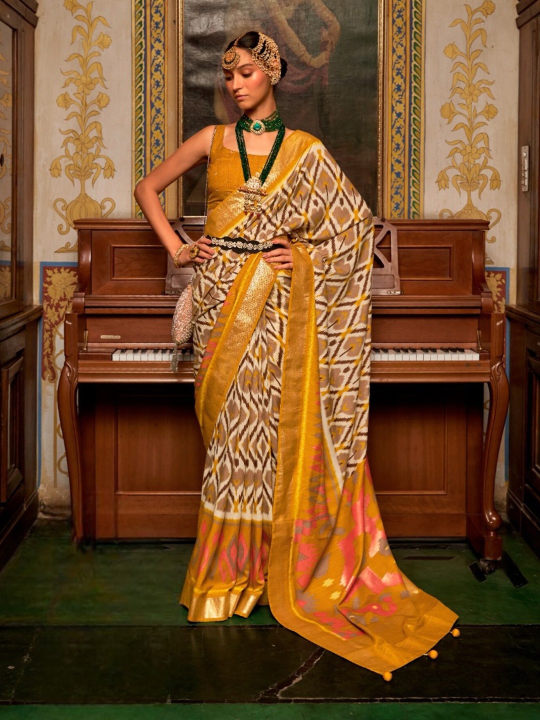

Mitera Cream-Coloured & Yellow Ethnic Motifs Printed Zari Patola Saree, Mustard