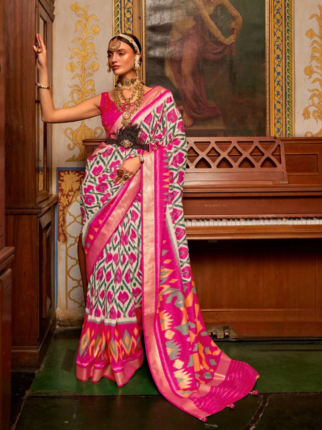 

Mitera Pink & White Ethnic Motifs Printed Zari Patola Saree