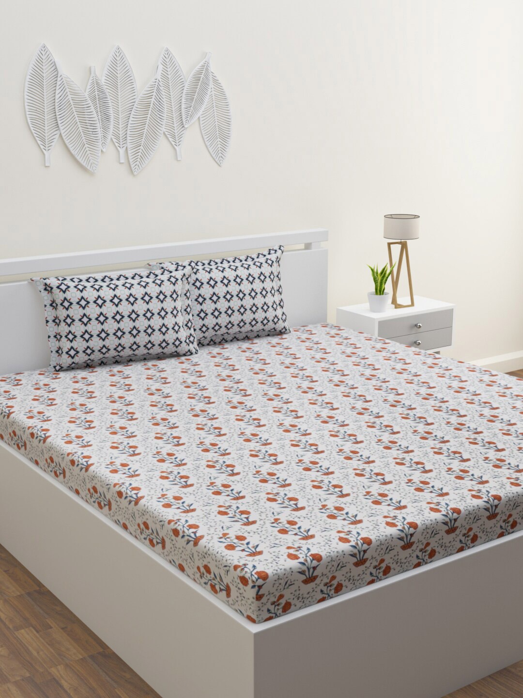 

HOME AFFAIRS White & Orange Floral 144 TC Cotton Queen Bedsheet With 2 Pillow Covers