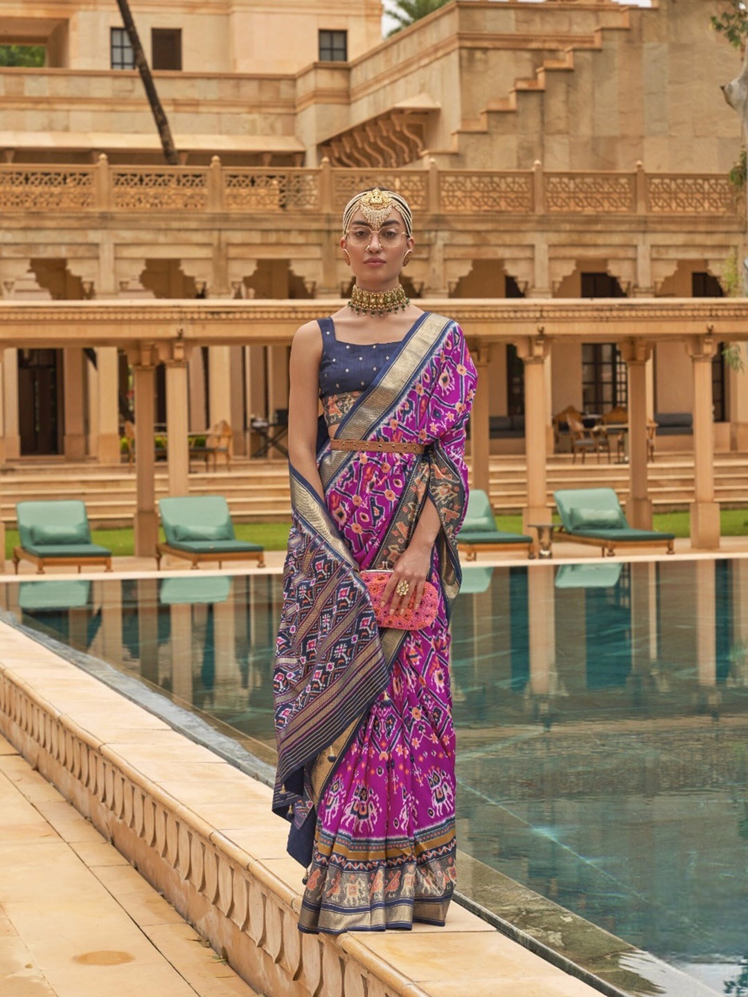 

Mitera Pink & Blue Ethnic Motifs Printed Zari Patola Saree