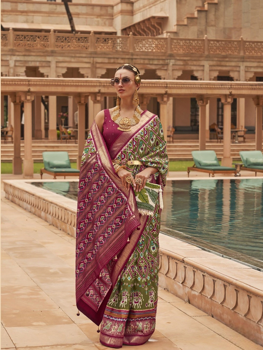 

Mitera Green & Purple Ethnic Motifs Printed Zari Patola Saree