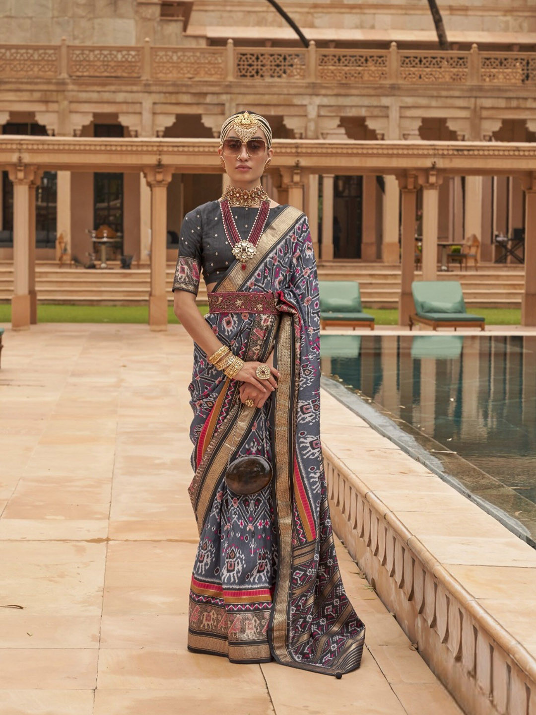 

Mitera Grey & Red Ethnic Motifs Printed Zari Patola Saree