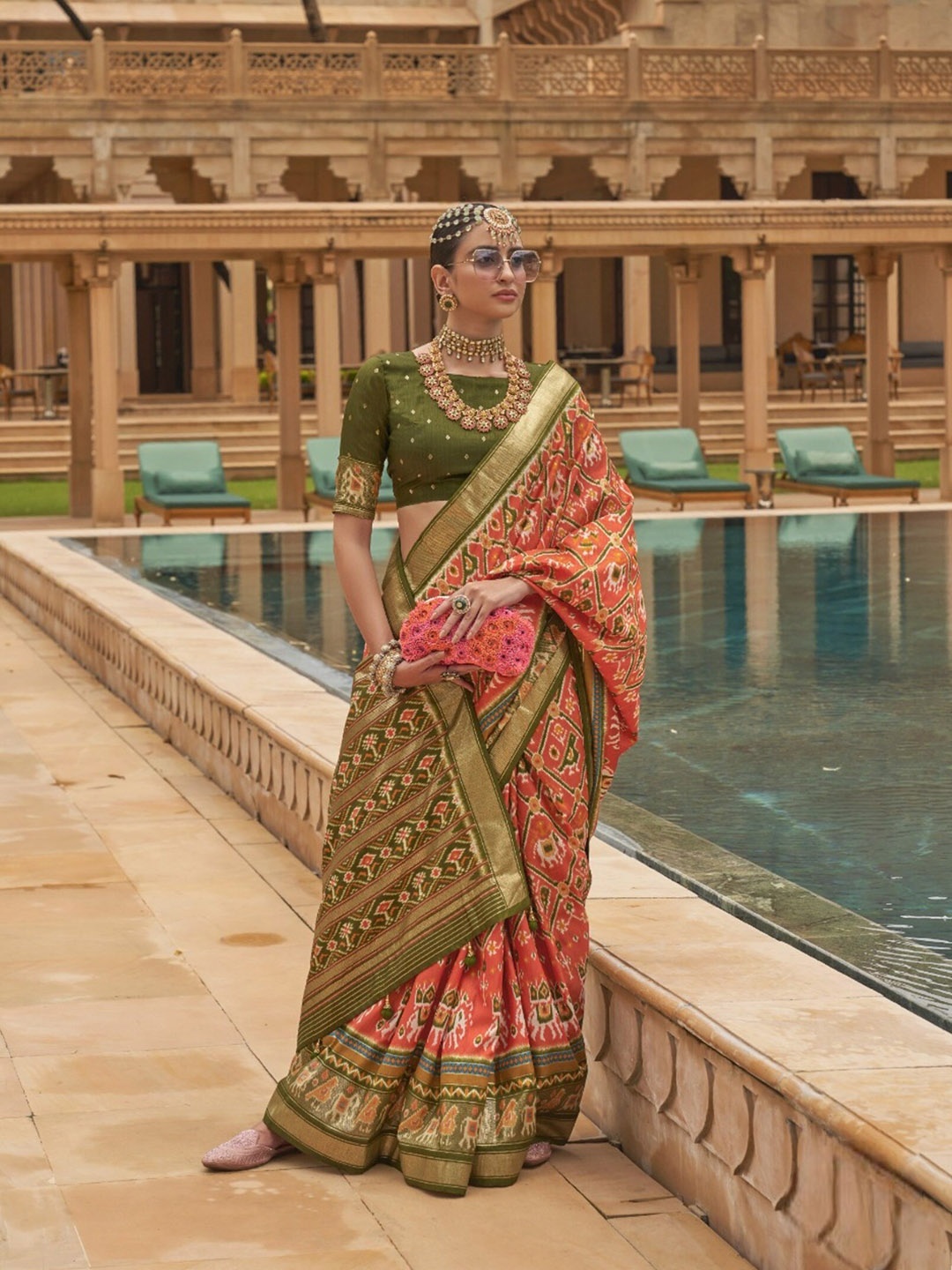 

Mitera Orange & Green Ethnic Motifs Printed Zari Patola Saree