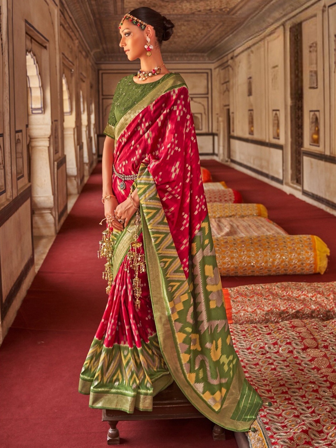 

Mitera Red & Green Ethnic Motifs Printed Zari Patola Saree