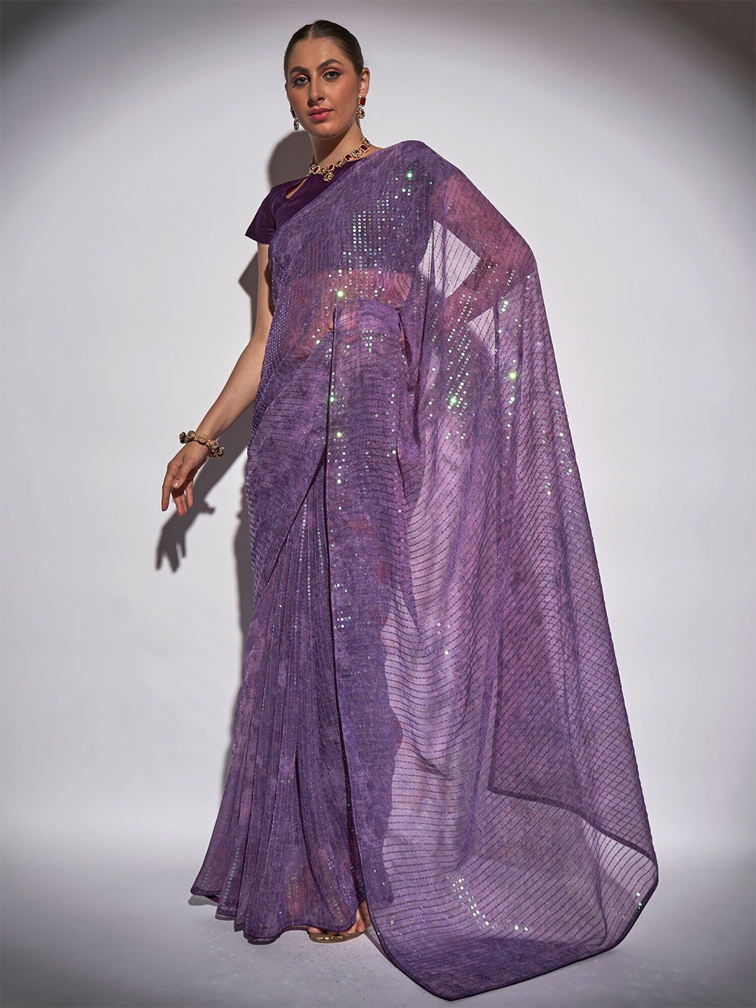 

Kalista Purple Sequined Pure Georgette Saree
