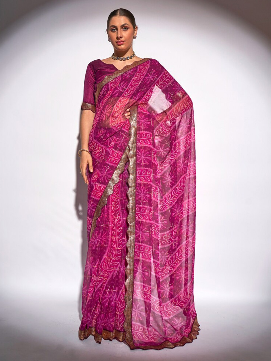 

Kalista Purple & White Bandhani Printed Sequined Pure Georgette Saree