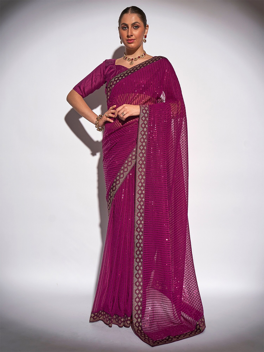 

Kalista Purple Sequined Pure Georgette Saree