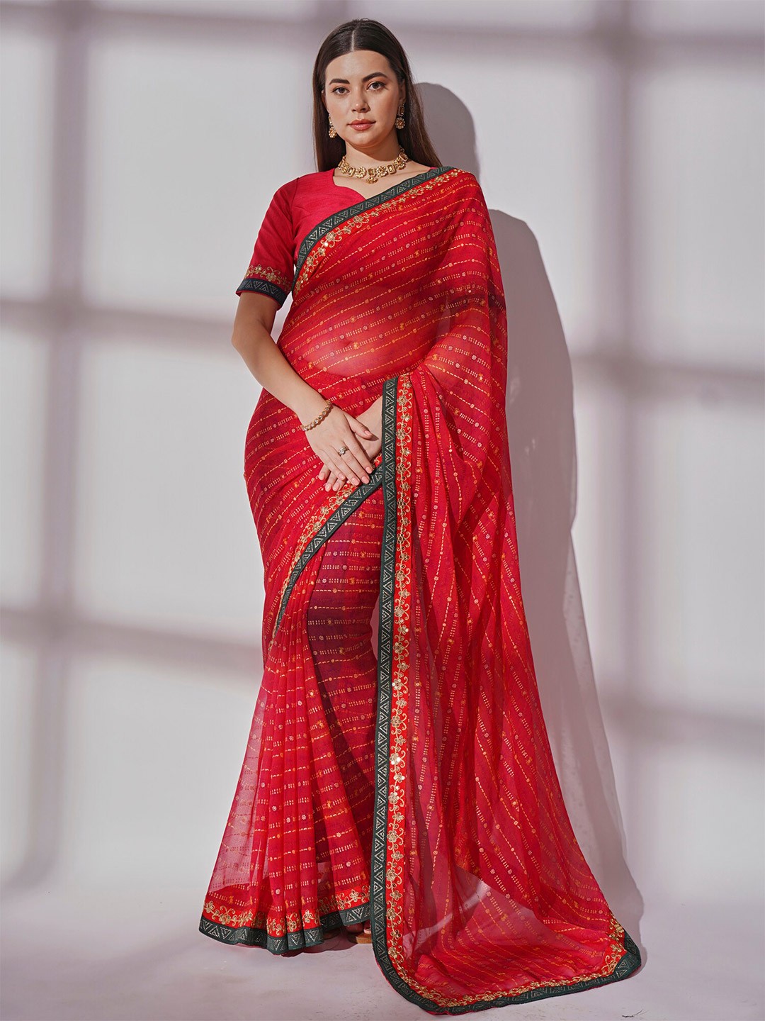 

Kalista Red & Gold-Toned Ethnic Motifs Printed Embroidered Pure Georgette Saree