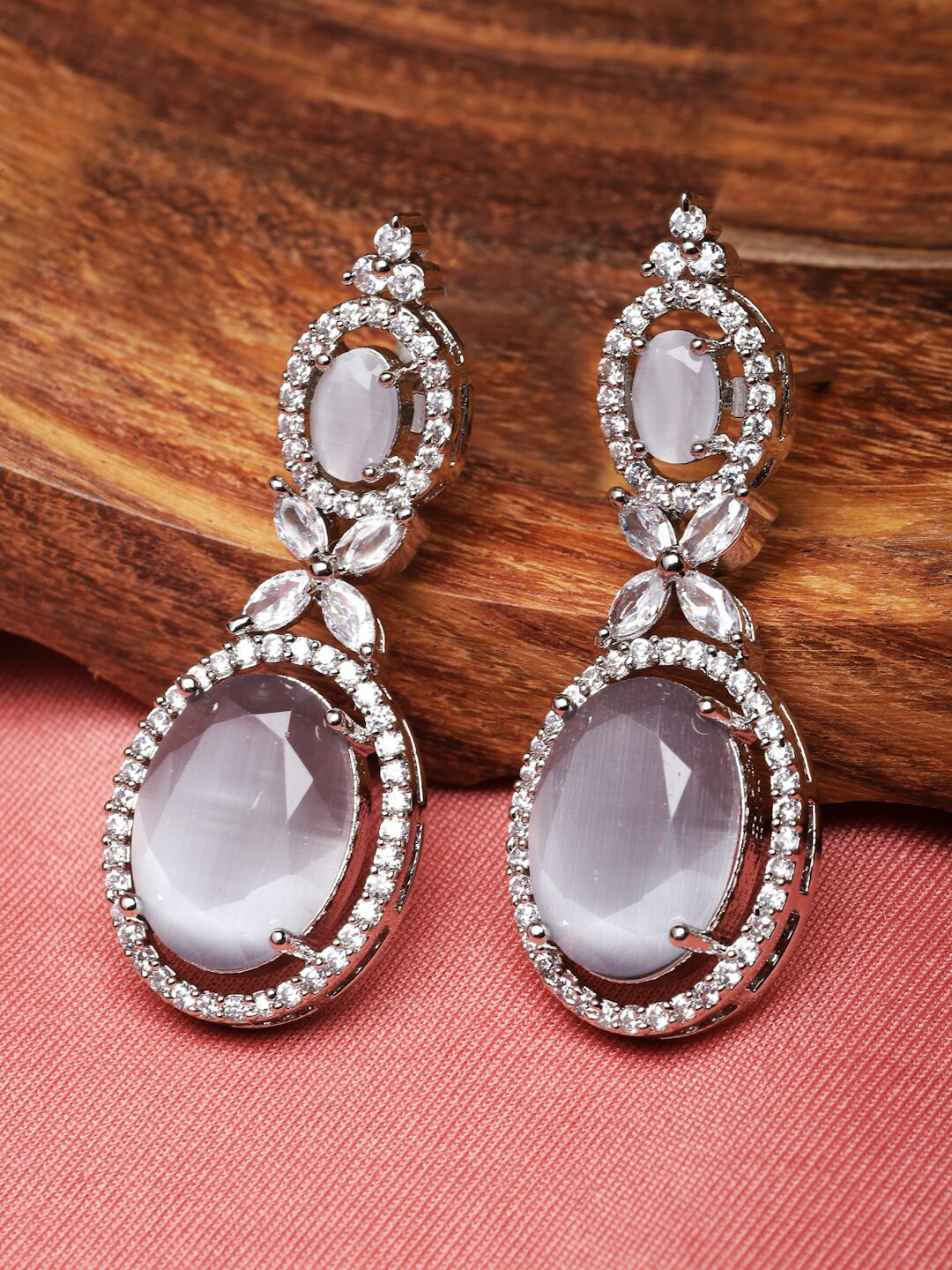 

ZENEME Rhodium-Plated American Diamond Studded Oval Shaped Drop Earrings, Silver