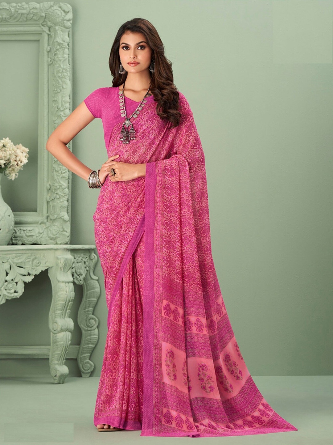 

Mitera Pink Ethnic Motifs Printed Poly Georgette Saree