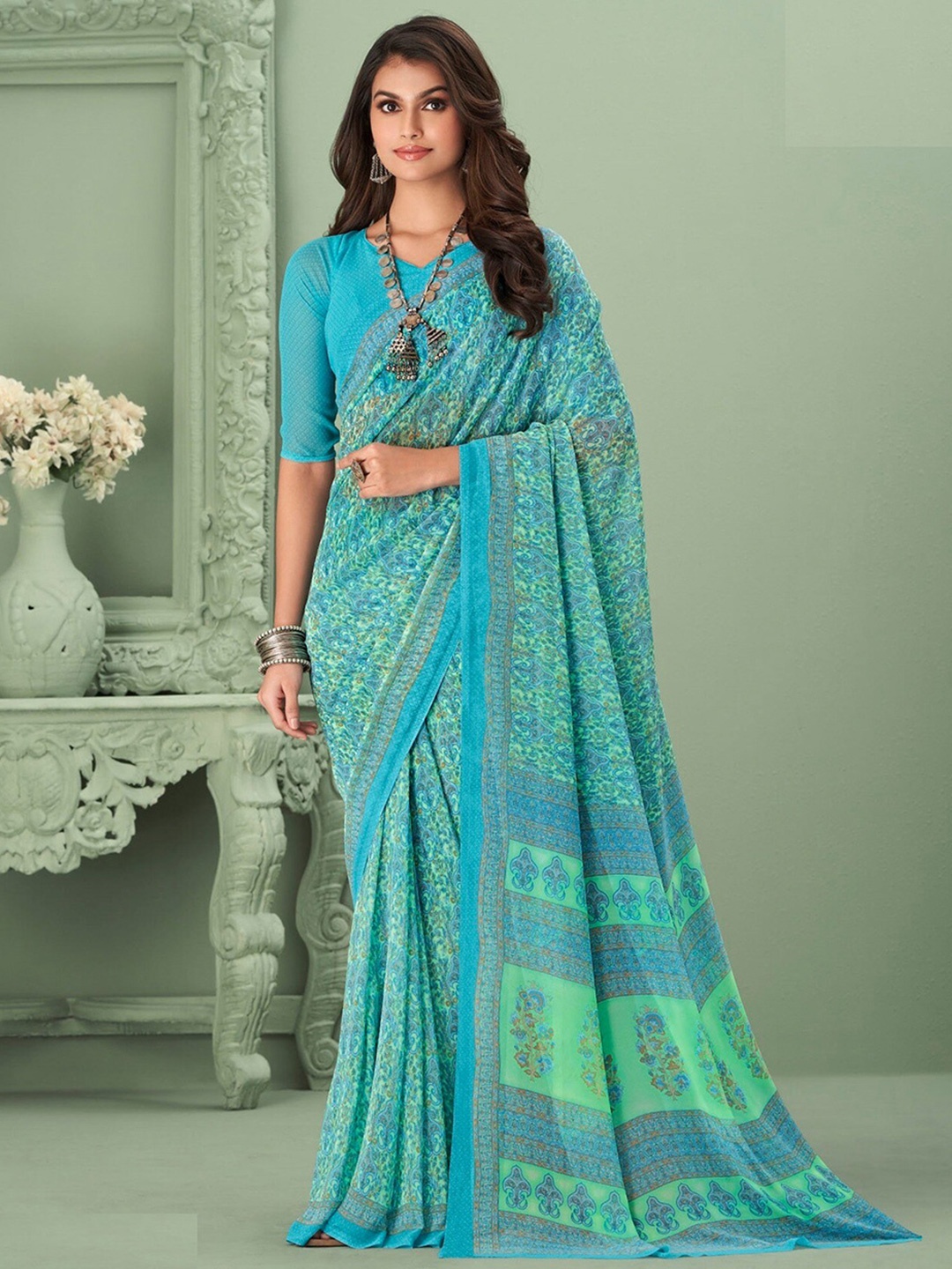 

Mitera Blue & Green Ethnic Motifs Printed Saree