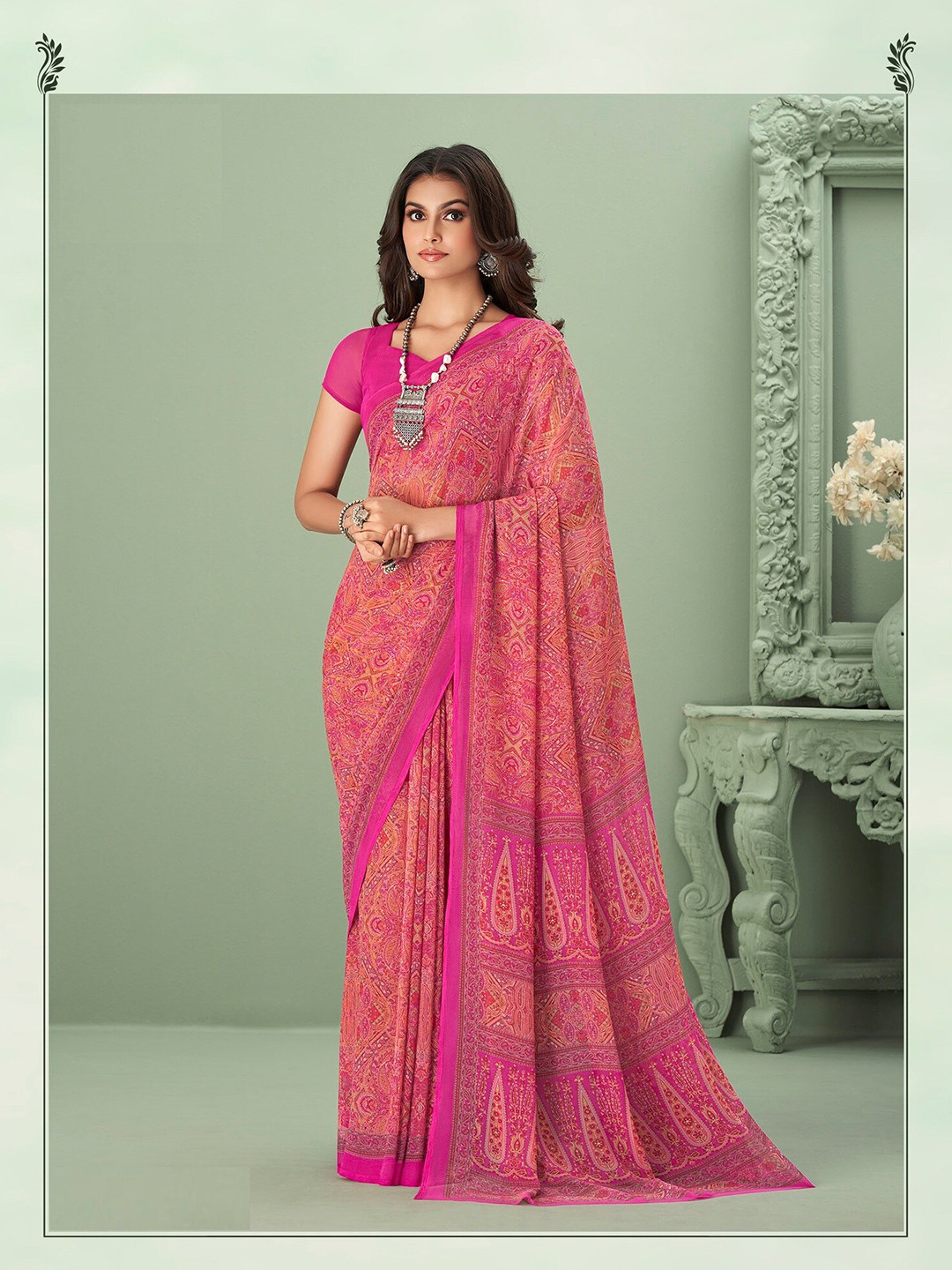 

Mitera Pink & Orange Ethnic Motifs Printed Poly Georgette Saree