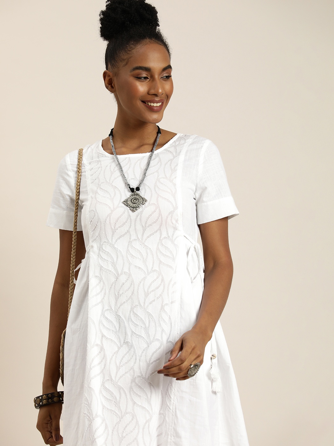 

Taavi Self Design Woven Festive A-Line Pure Cotton Ethnic Dress With Tie-ups Detail, White