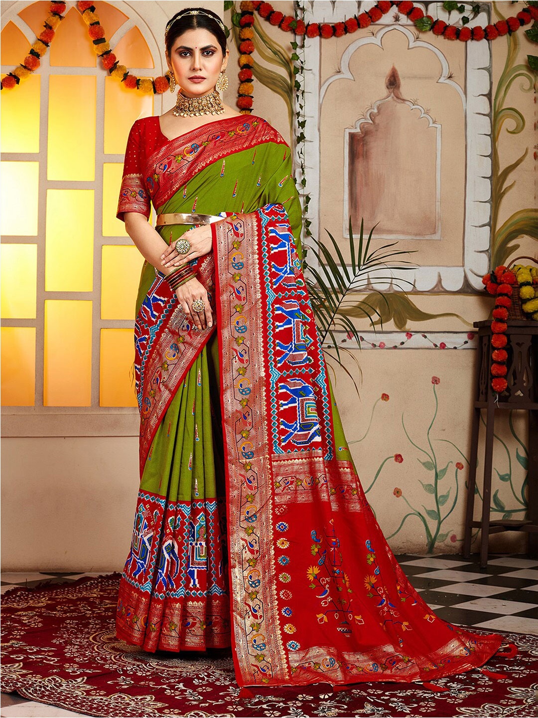 

Anouk Ethnic Motifs Printed Zari Patola Saree, Olive
