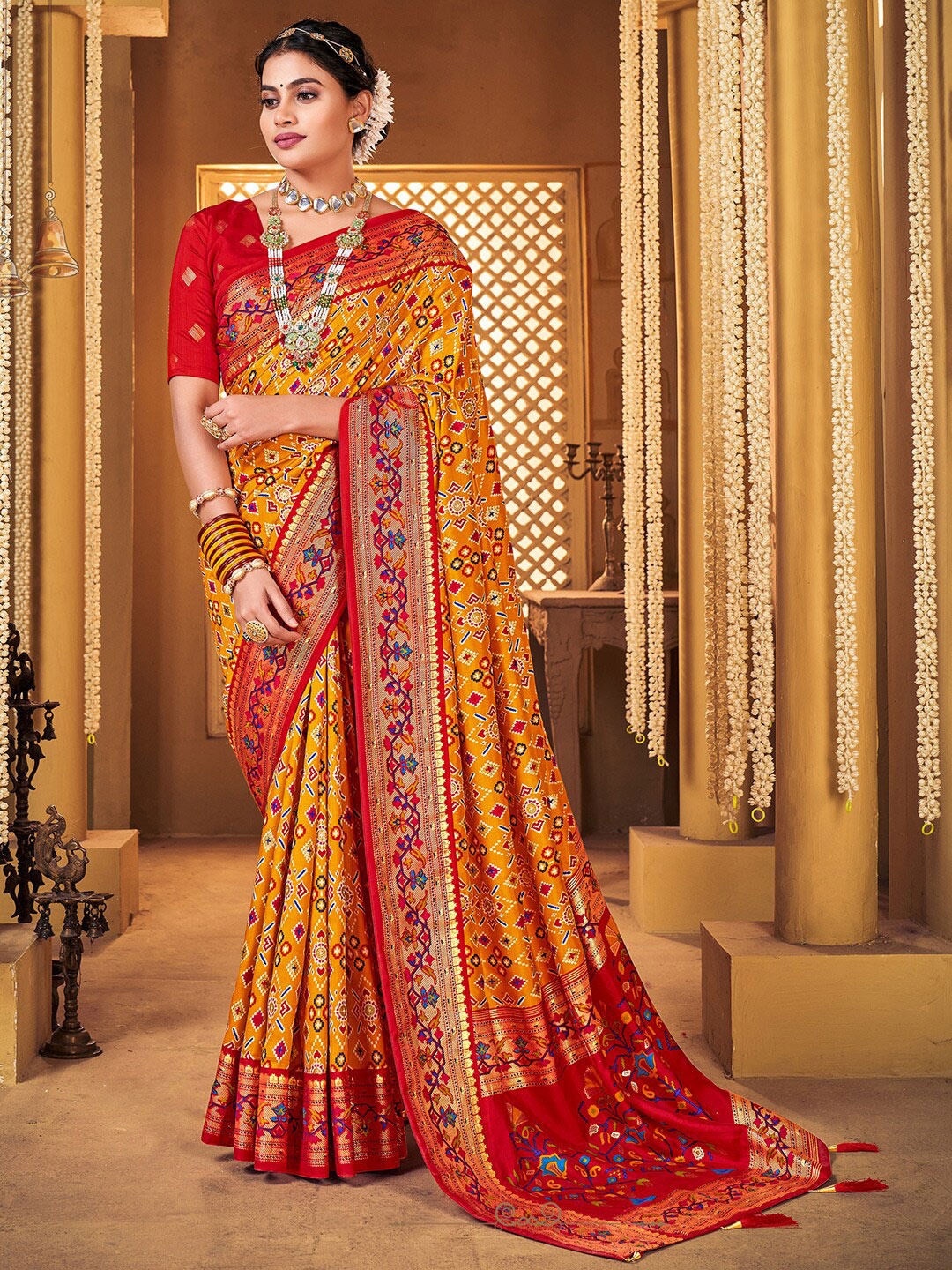 

Anouk Ethnic Motifs Printed Zari Patola Saree, Mustard