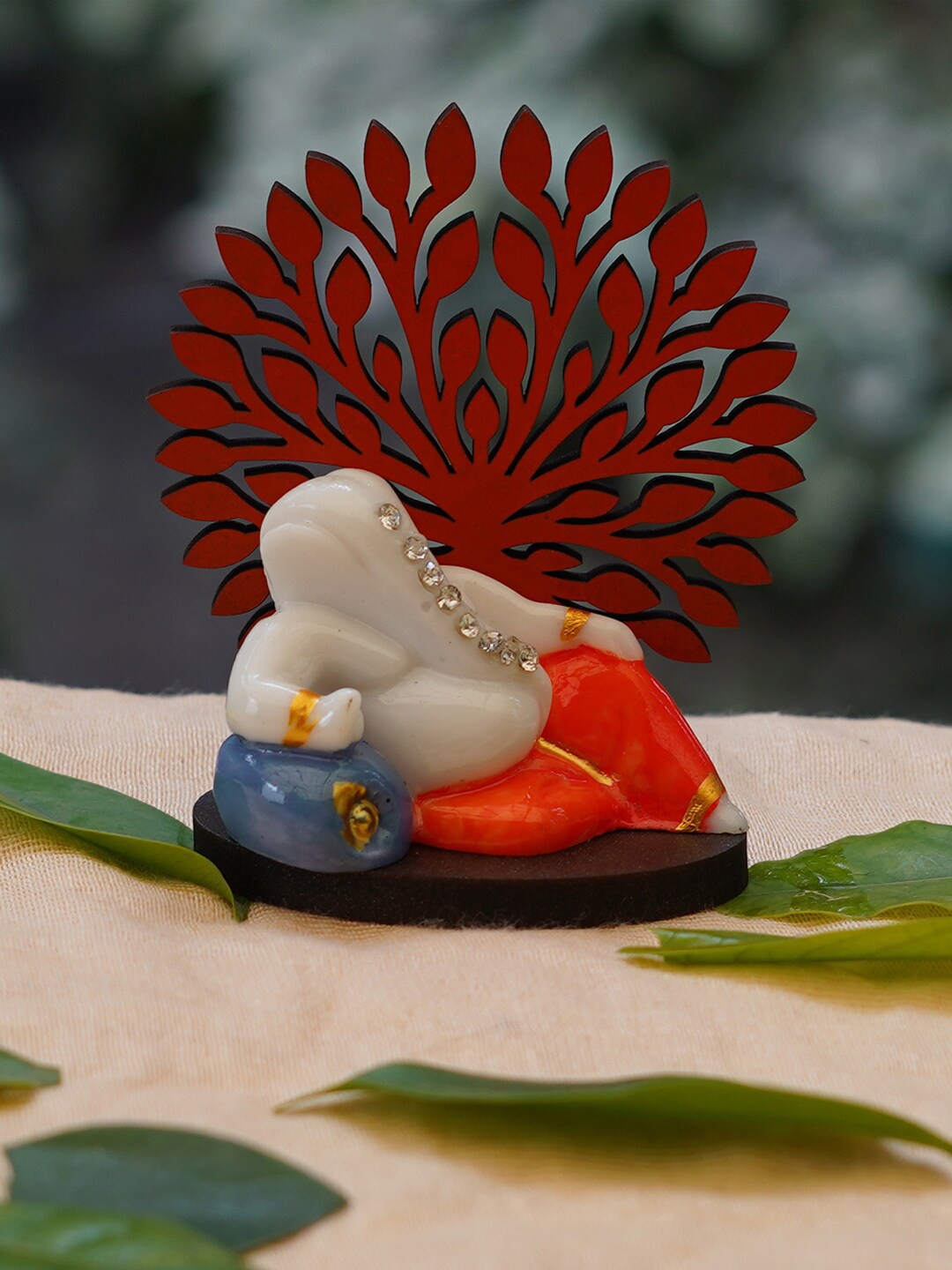 

Gallery99 Orange & White Resting Ganesha Showpiece