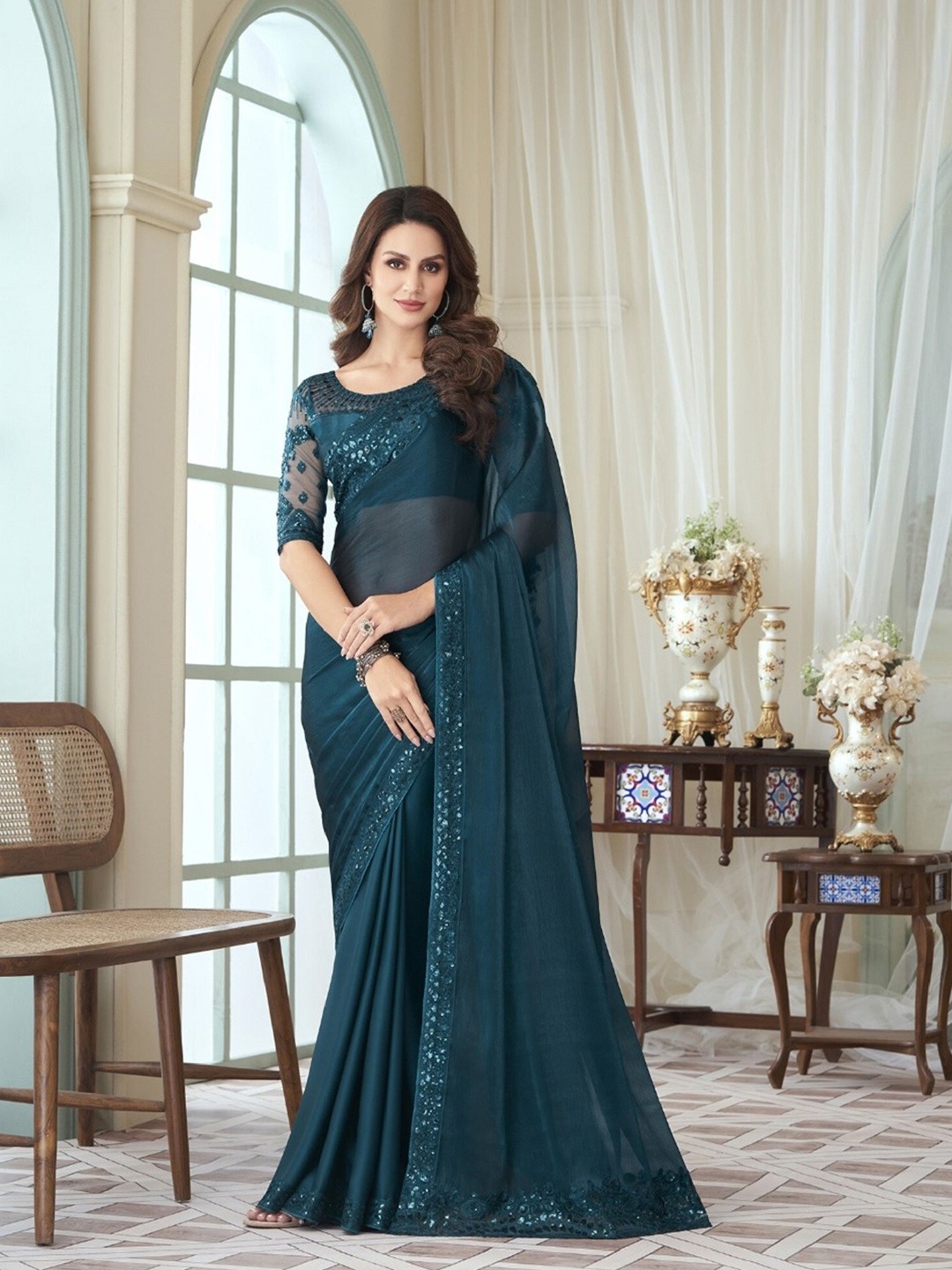 

Mitera Teal Embroidered Saree