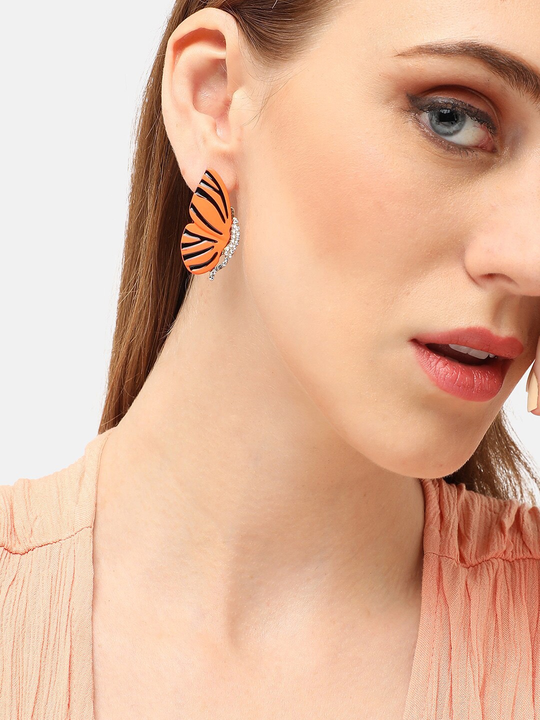 

SOHI Gold Plated Butterfly Shaped Stone Studded Studs Earrings