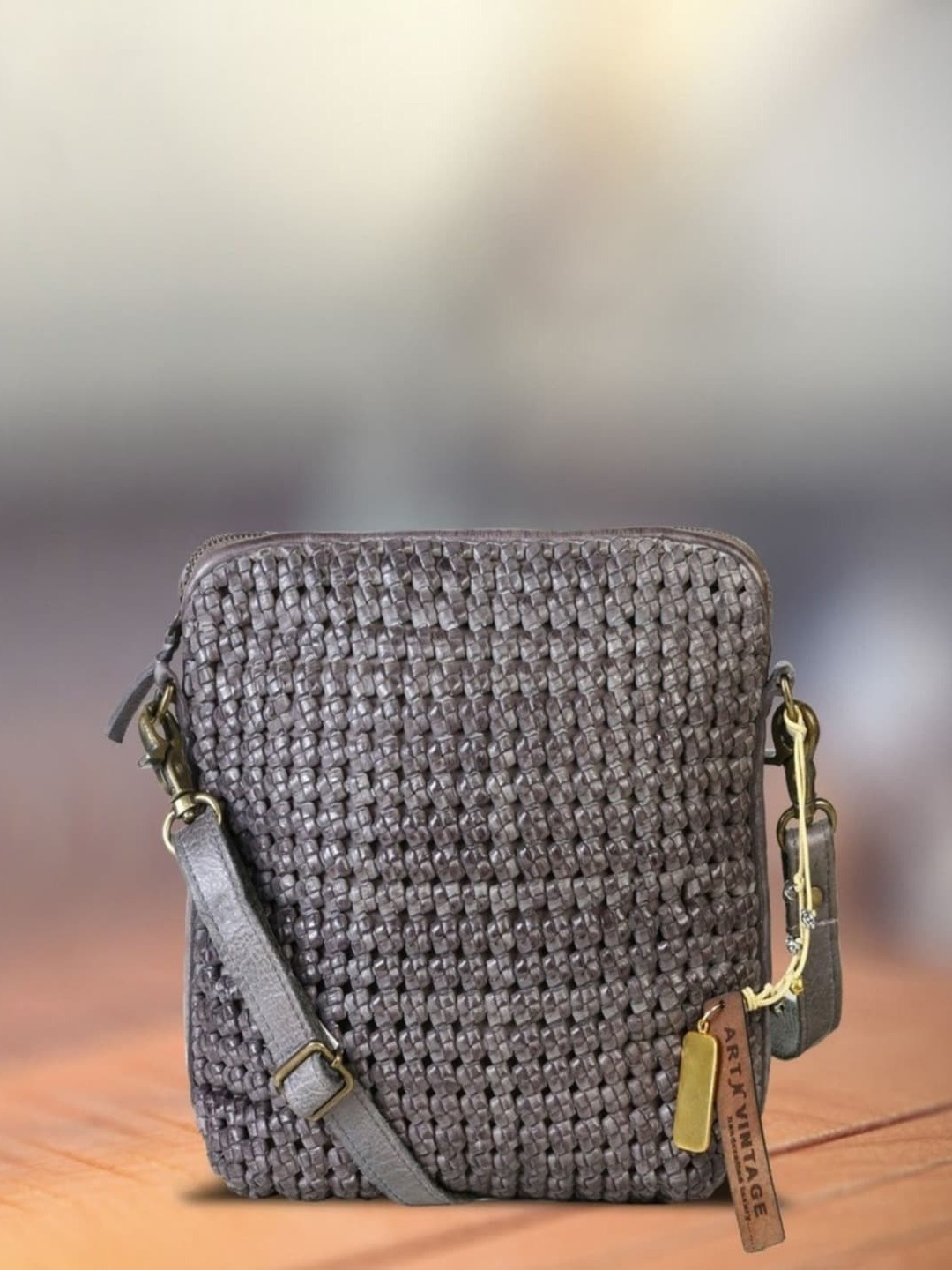 

ART N VINTAGE Textured Leather Structured Sling Bag with Tasselled, Grey
