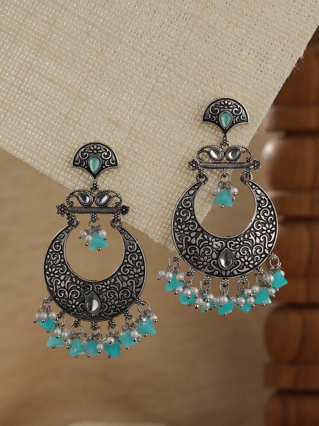 

Jazz and Sizzle Silver-Plated Stone Studded Crescent Shaped Chandbalis