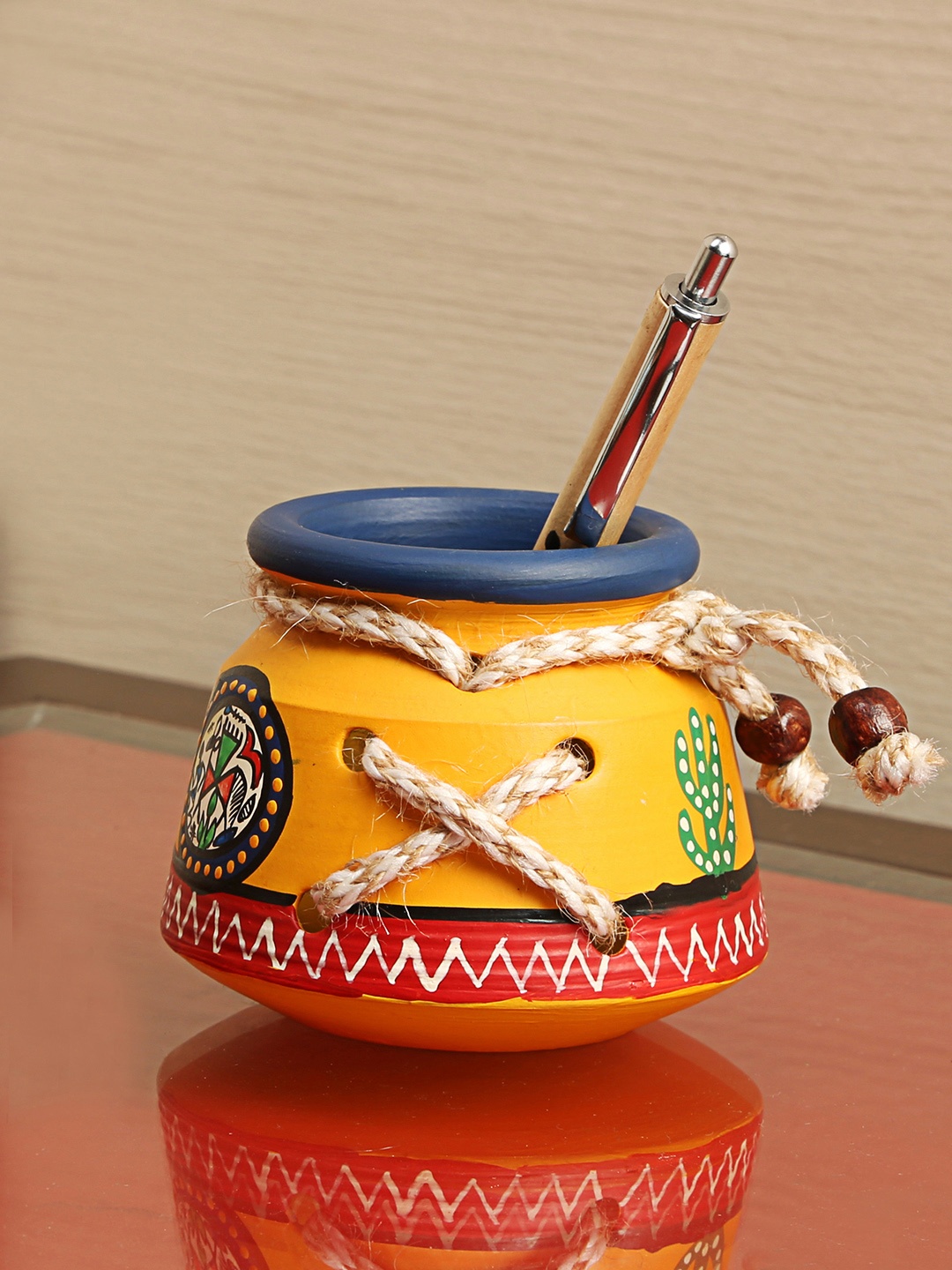 

ExclusiveLane Yellow Terracotta Warli Handpainted Pen Stand Organiser