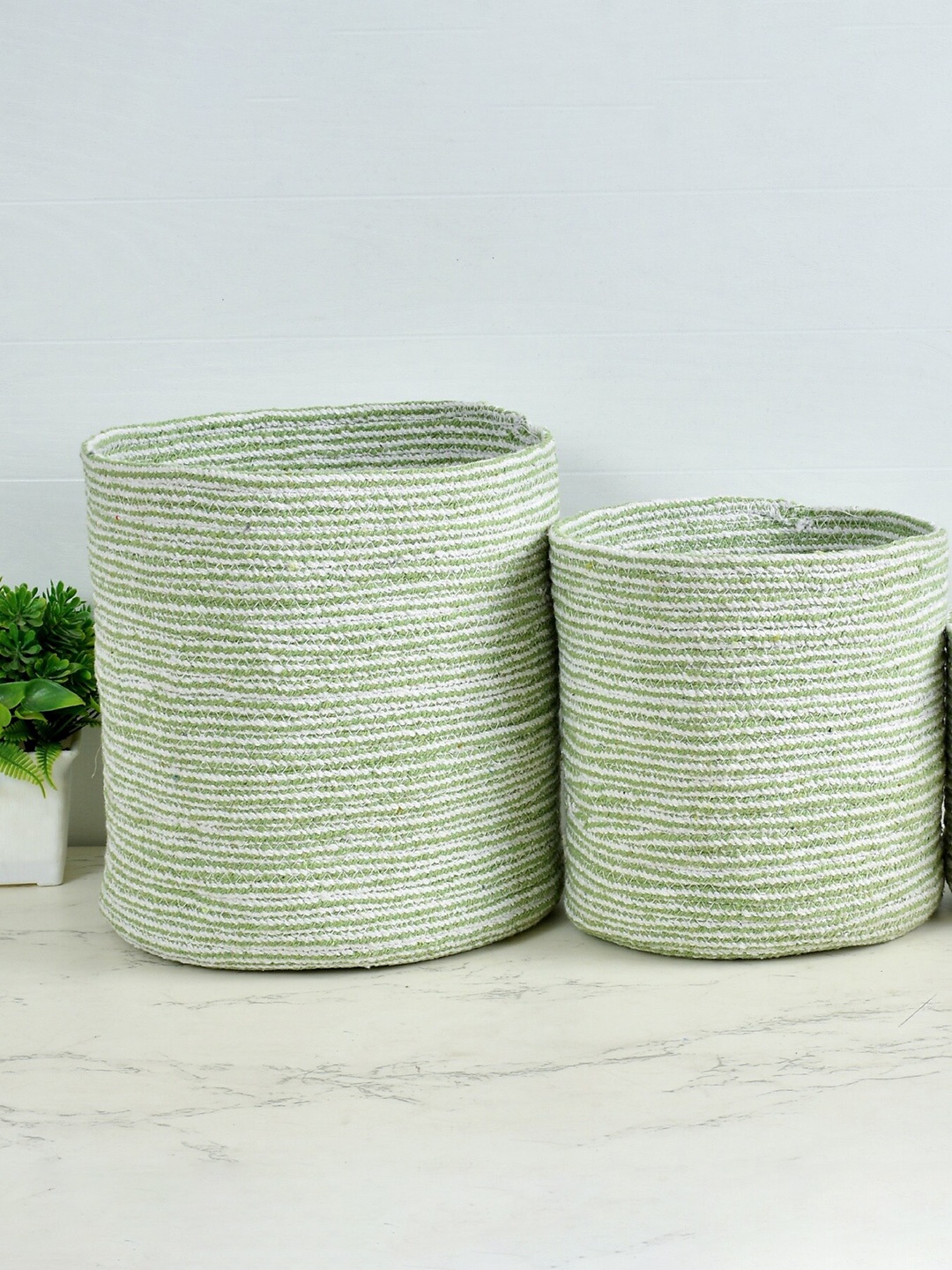 

Homefab India 2-Pieces Green & White Braided Woven Design Cotton Planter Baskets