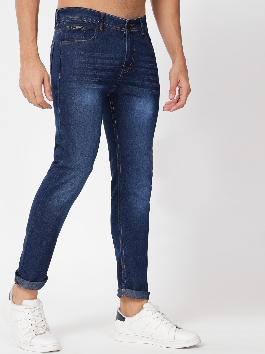 

UNITED DENIM Men Mid Rise Slim Fit Light Fade Low Distress Stretchable Jeans, Blue
