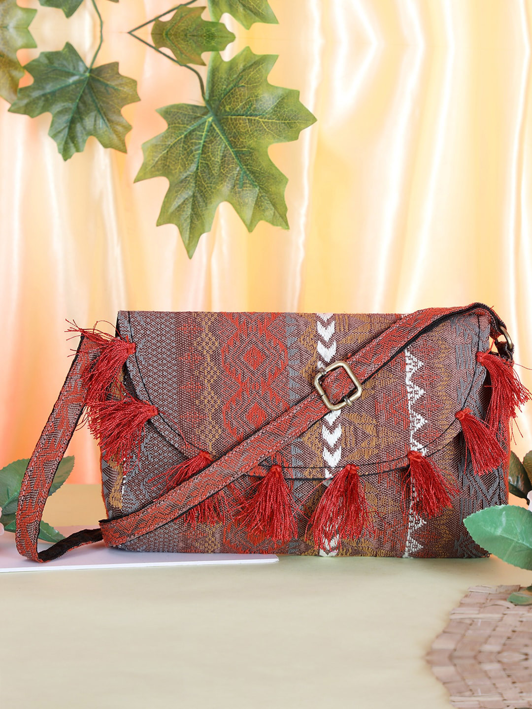 

gaura pakhi Women Textured Sling Bag with Tasselled, Brown