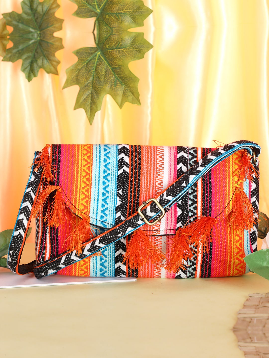 

gaura pakhi Women Floral Printed Structured Sling with Tasselled, Orange