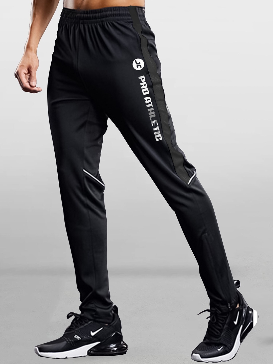 

JUMPCUTS Men Printed Slim-Fit Track Pants, Black