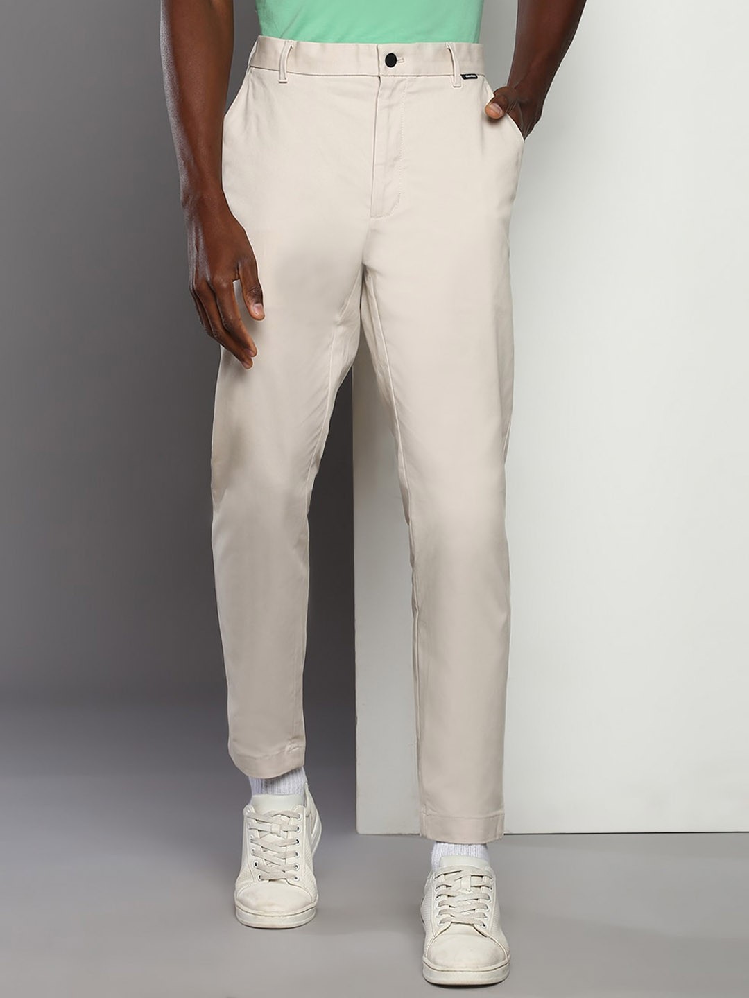

Calvin Klein Jeans Men Loose Fit Mid-Rise Trousers, Beige