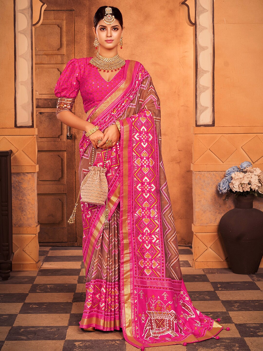 

Anouk Brown & Pink Ethnic Motifs Printed Zari Patola Saree