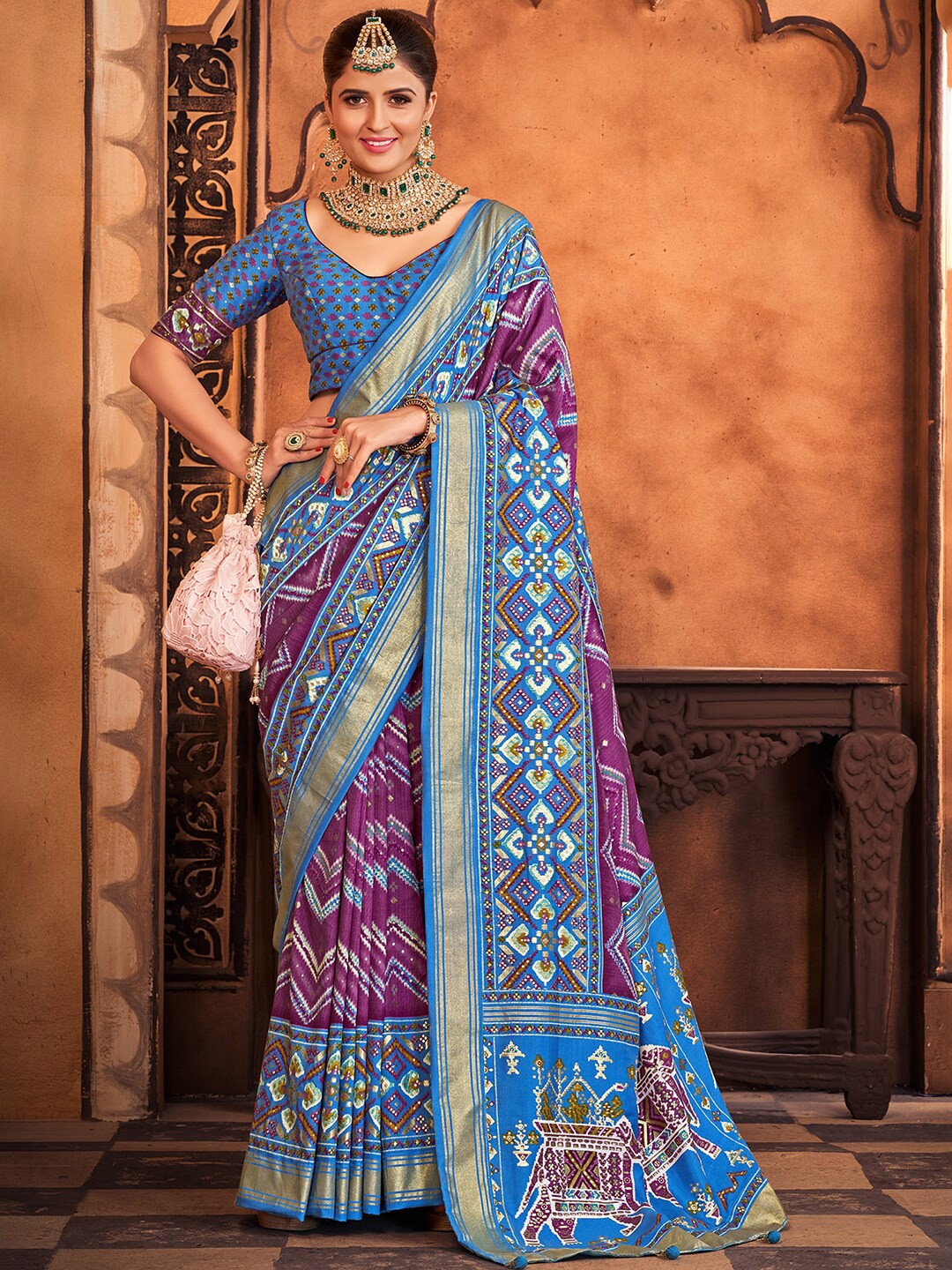 

Anouk Purple & Blue Ethnic Motifs Printed Zari Patola Saree
