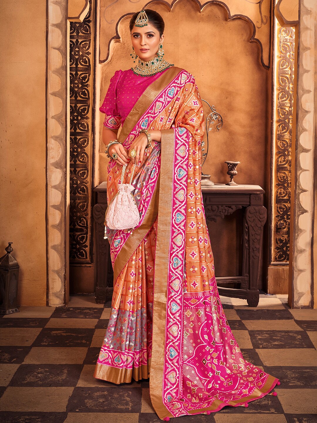 

Anouk Peach & Orange Ethnic Motifs Printed Zari Patola Saree