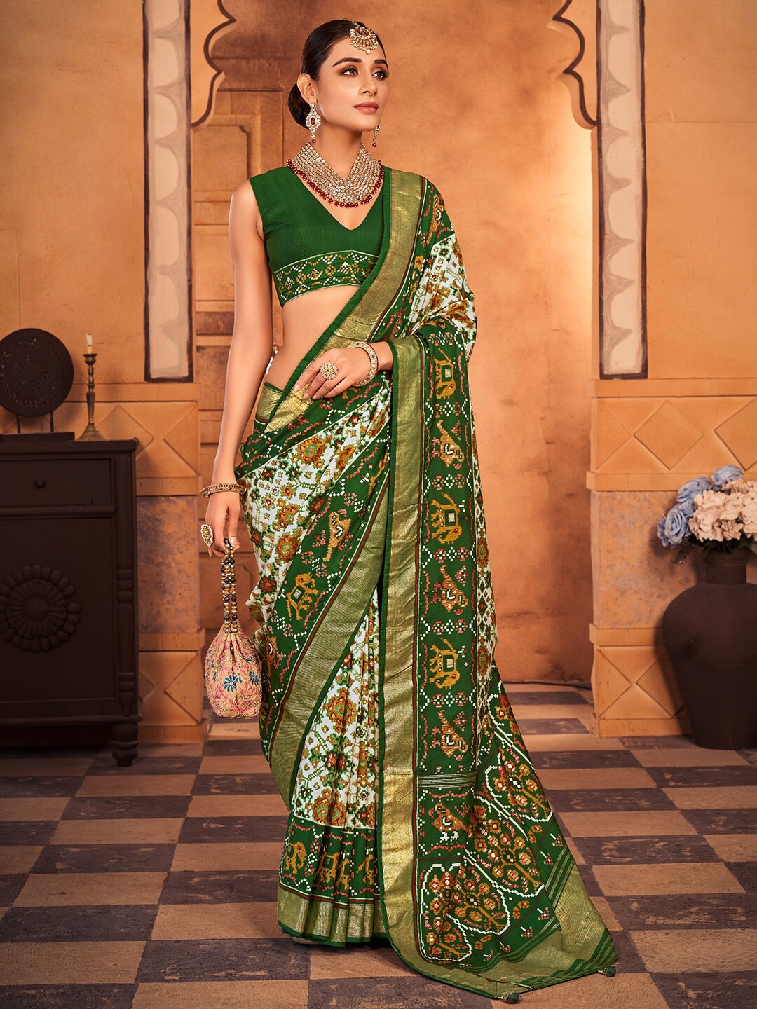 

Anouk White & Green Ethnic Motifs Printed Zari Patola Saree
