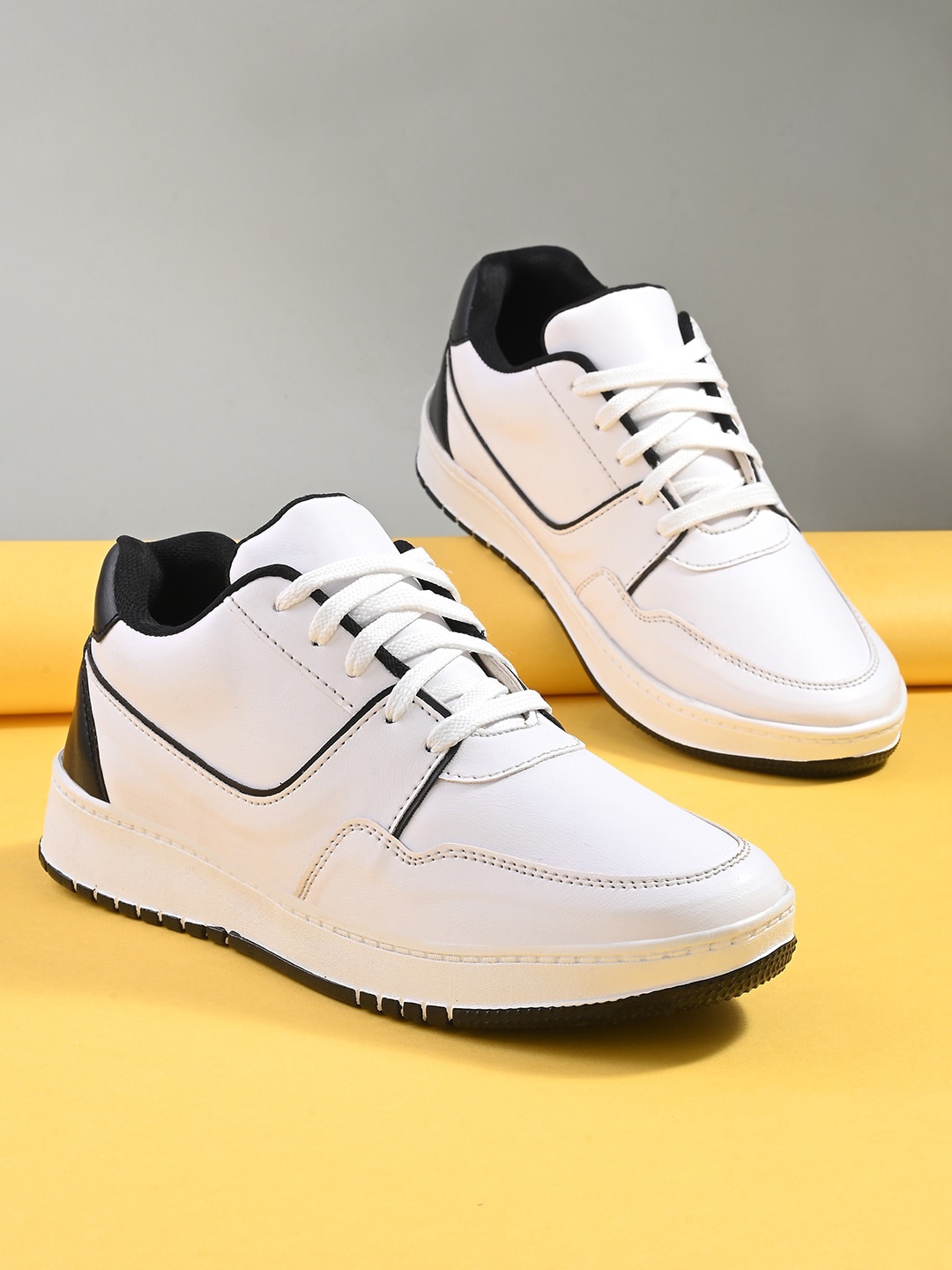 

Mast & Harbour Men White And Black Colourblocked Sneakers