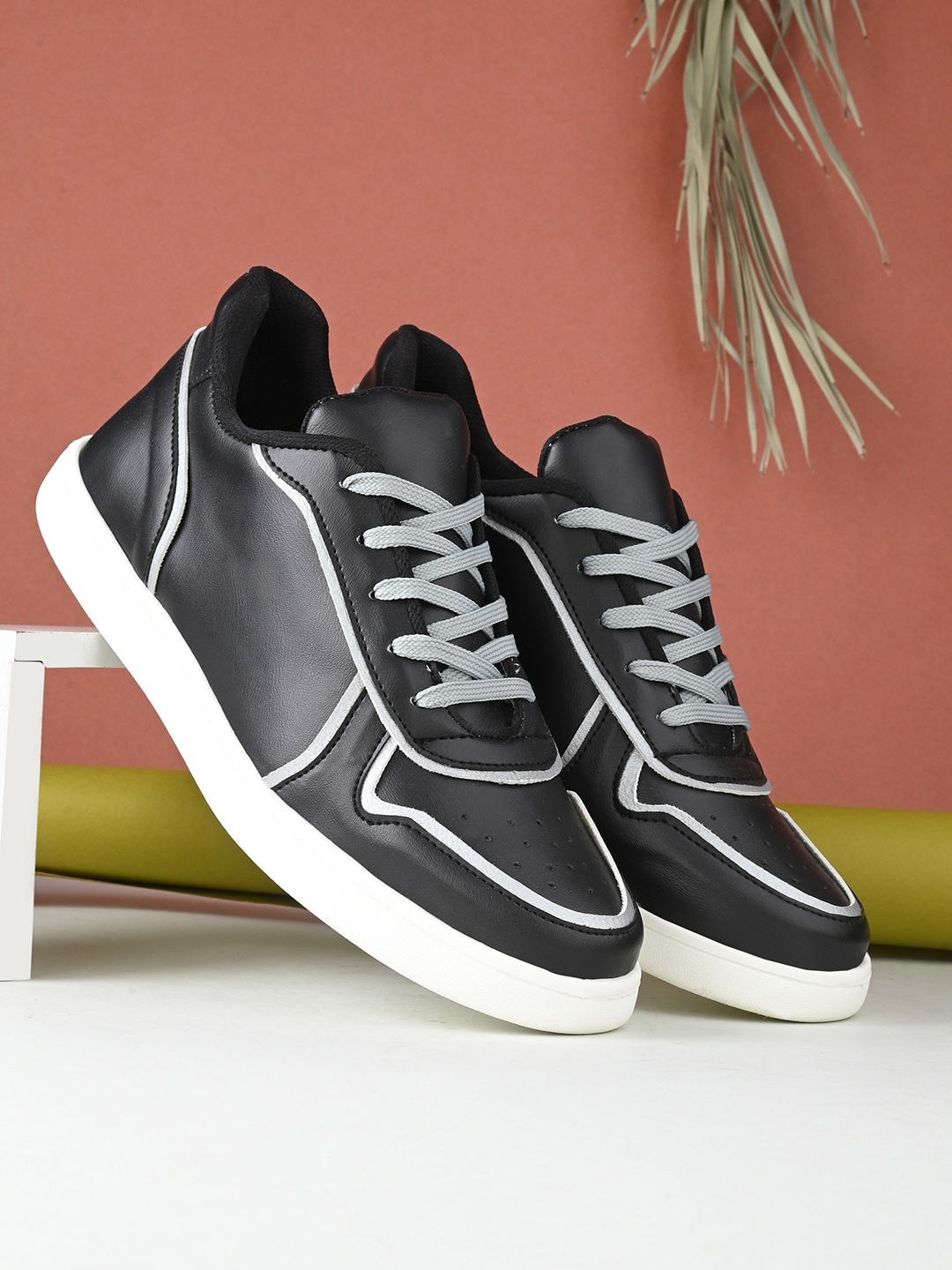 

Kook N Keech Men Black And White Perforated Sneakers