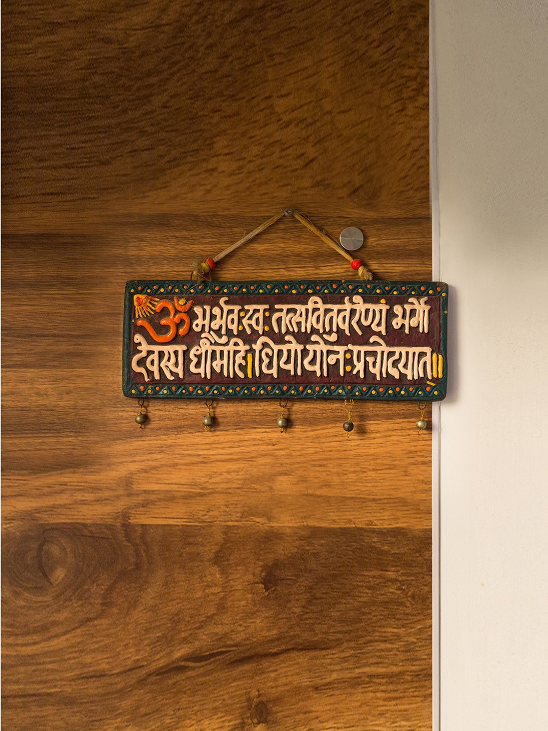 

ExclusiveLane Brown & White Gayathri Mantra Terracotta Wall Hanging
