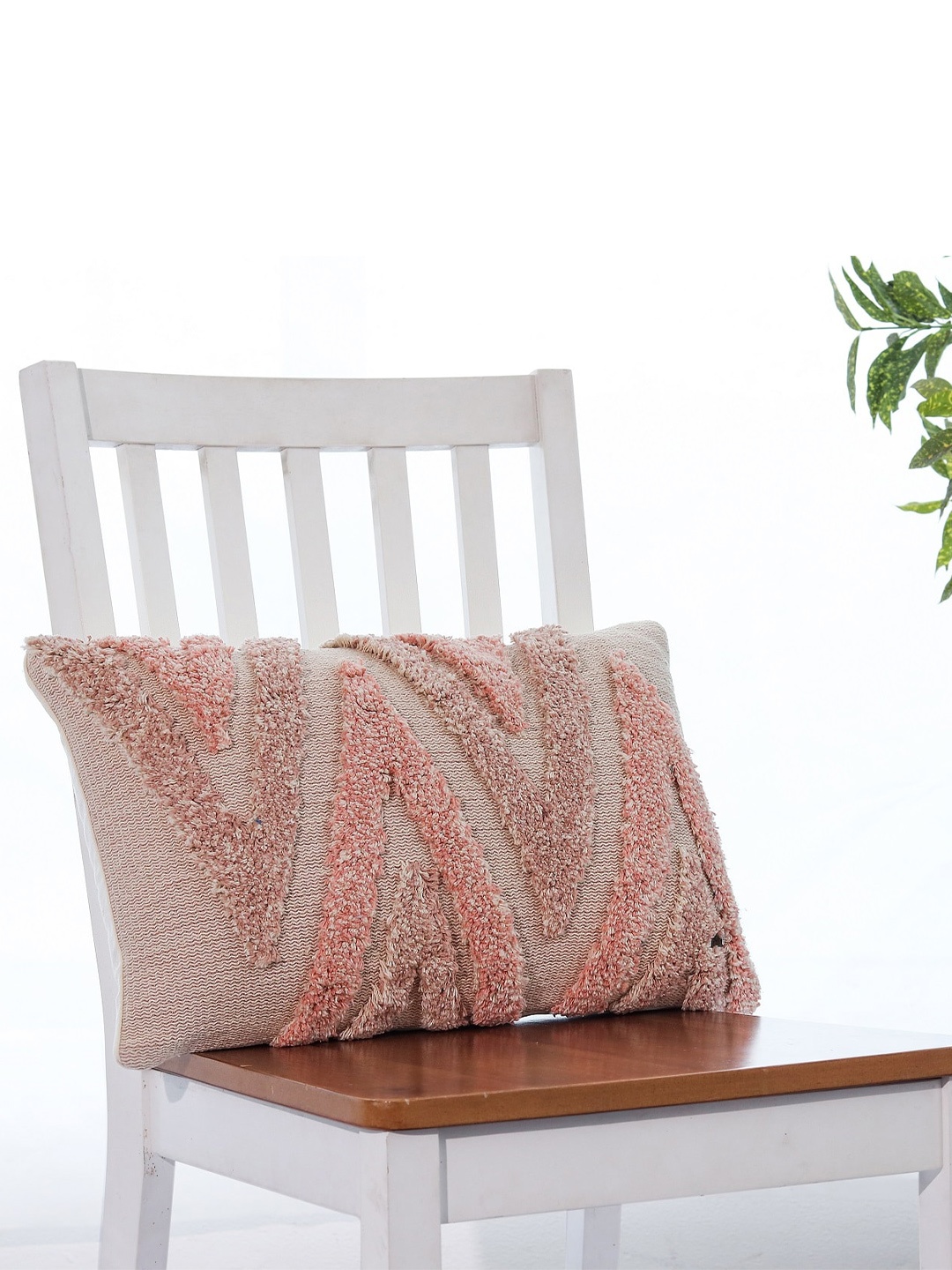 

Pluchi Arrowhead Pink & Beige Geometric Knitted Rectangle Cushion Cover
