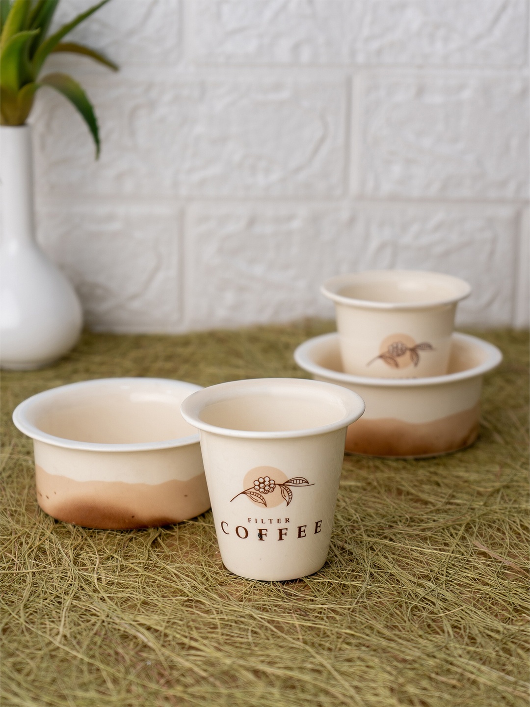 

CLAY CRAFT Cream-Coloured 4 Pieces Printed Ceramic Glossy Tumblers and Dabara