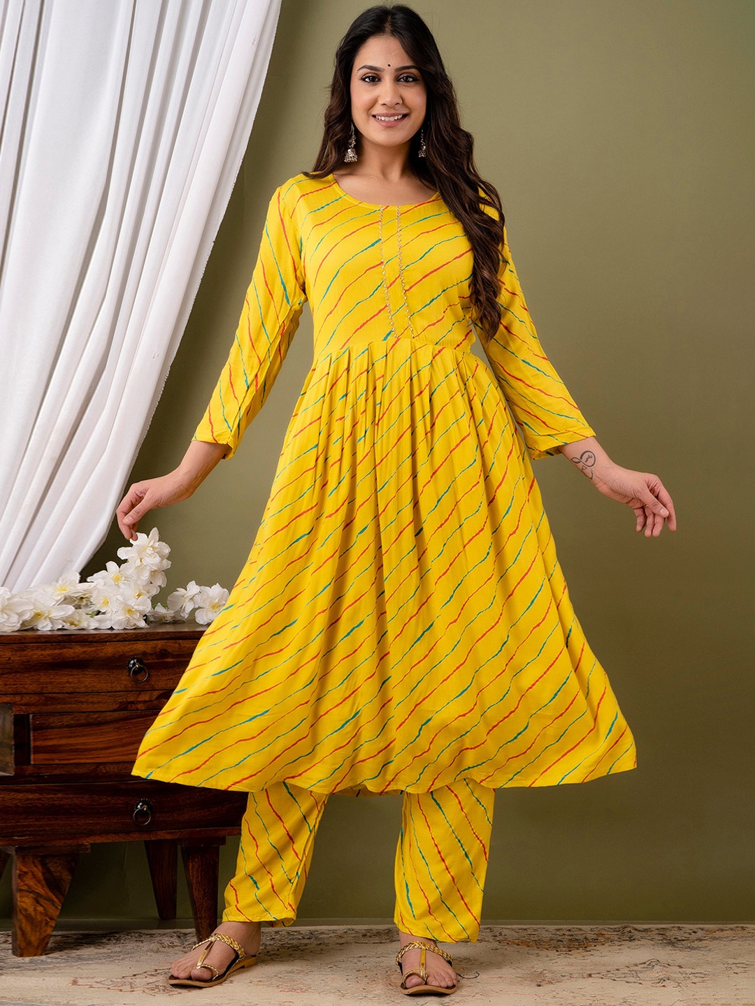 

Mialo fashion Leheriya Printed Pleated Anarkali Kurta With Palazzos, Yellow