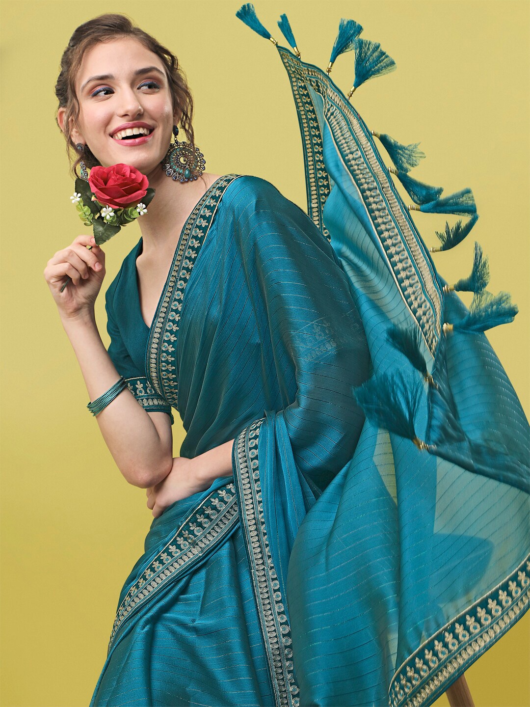 

Sangria Teal Blue Striped Zari Saree