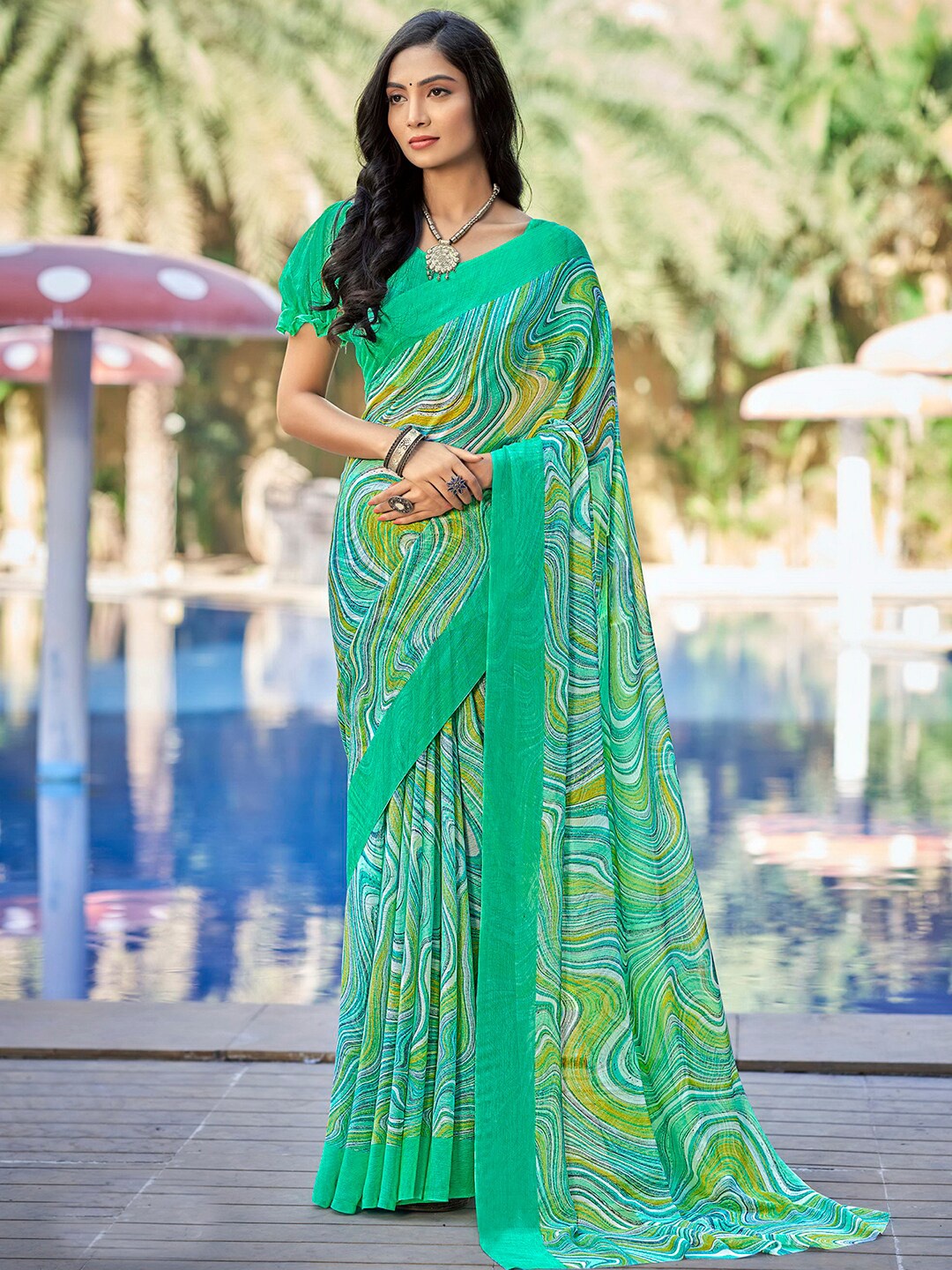 

Satrani Turquoise Blue & Mustard Pure Chiffon Saree
