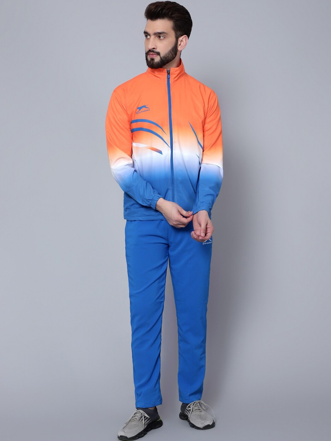 

Shiv Naresh Men Colourblocked High Neck Sports Tracksuit, Orange