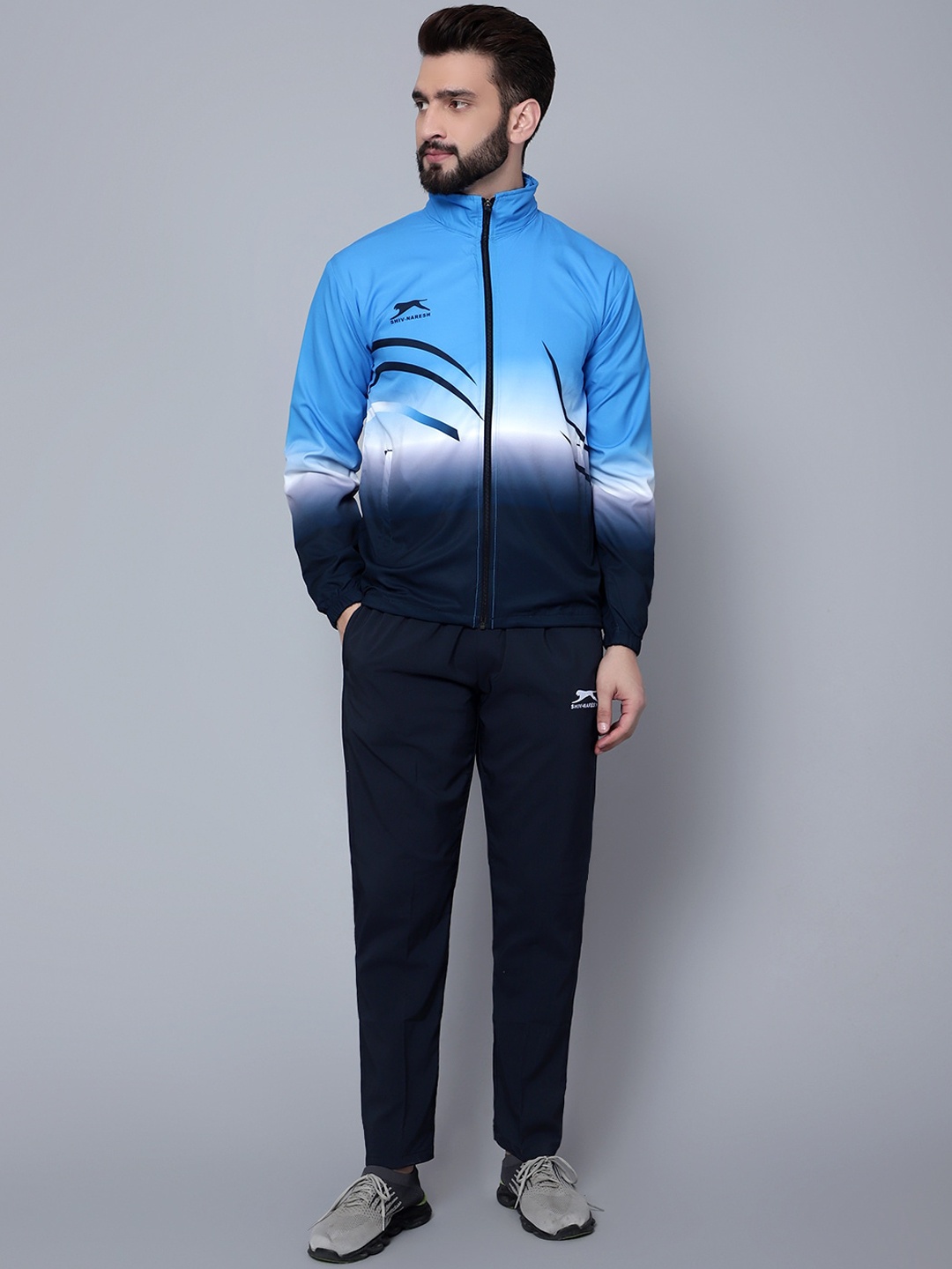 

Shiv Naresh Men Colourblocked High Neck Sports Tracksuit, Blue