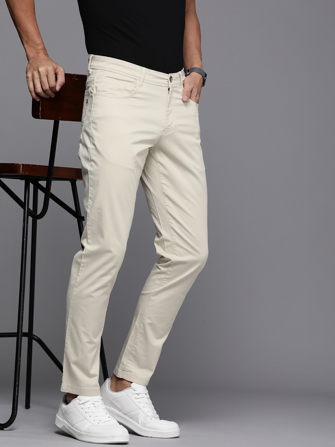 

Louis Philippe Jeans Men Flat Front Comfort Tapered Fit Low-Rise Trousers, Beige