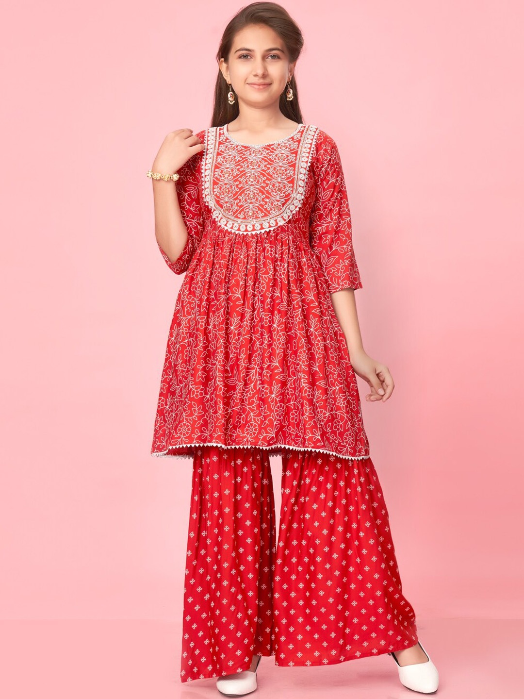

Aarika Girls Floral Printed Panelled Thread Work Pure Cotton Kurti with Sharara, Orange
