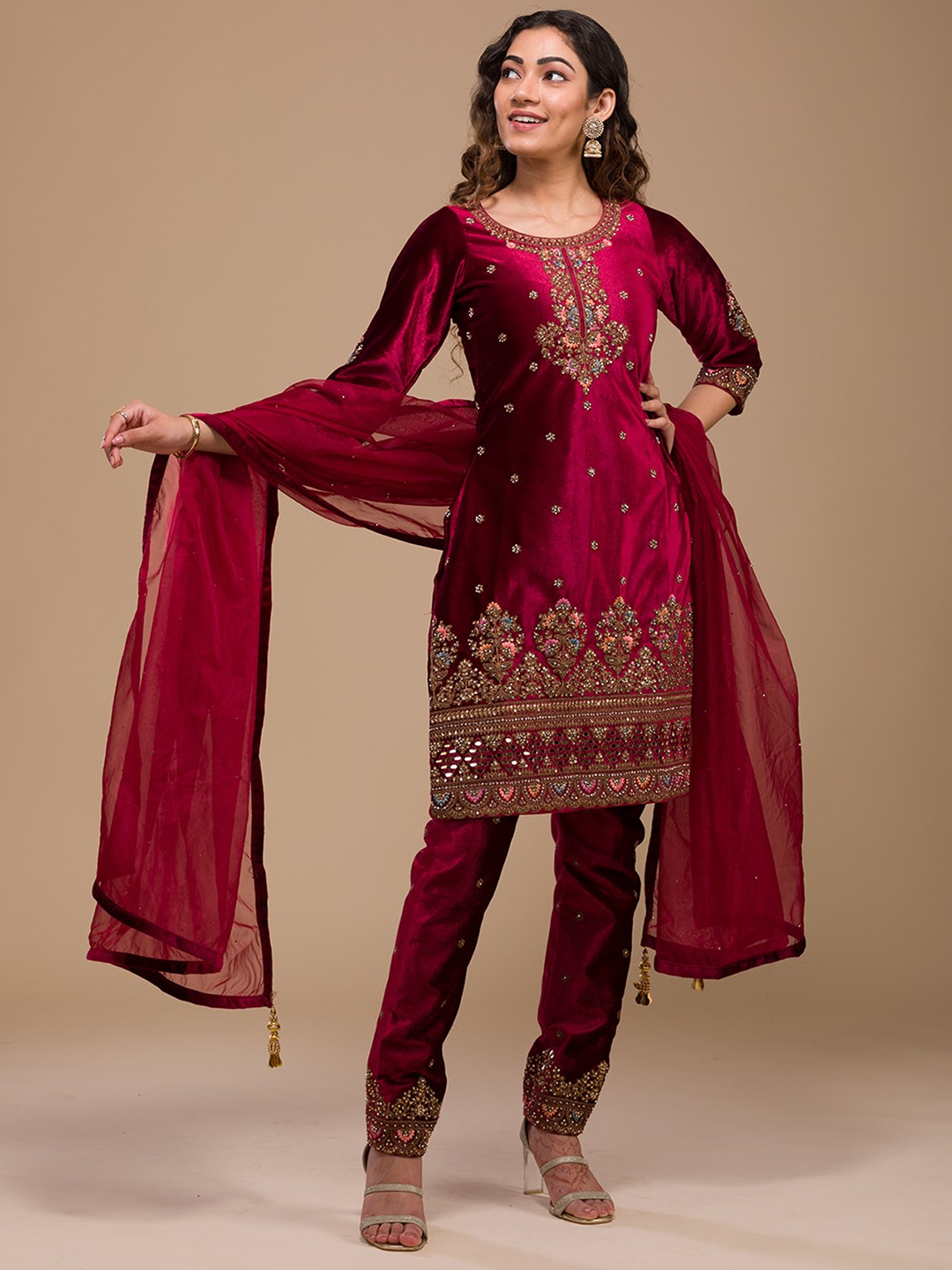 

Koskii Ethnic Motifs Embroidered Sequined Velvet Kurti with Trousers, Maroon