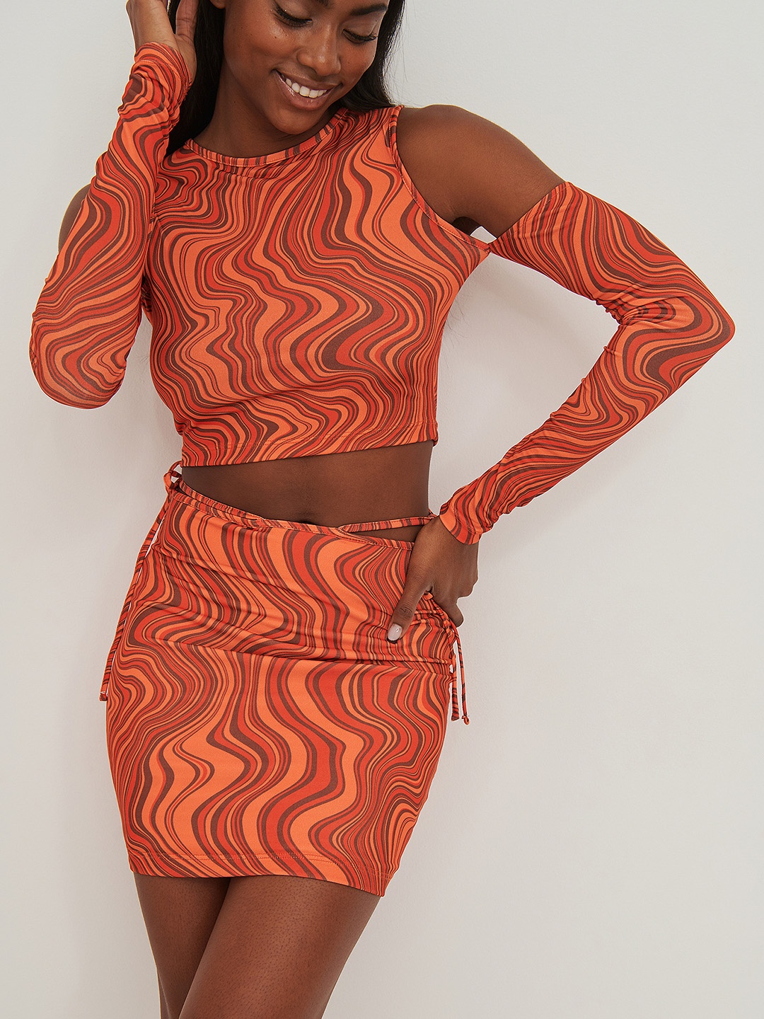 

NA-KD Abstract Print Tie-Up Detail Bodycon Mini Skirt, Orange