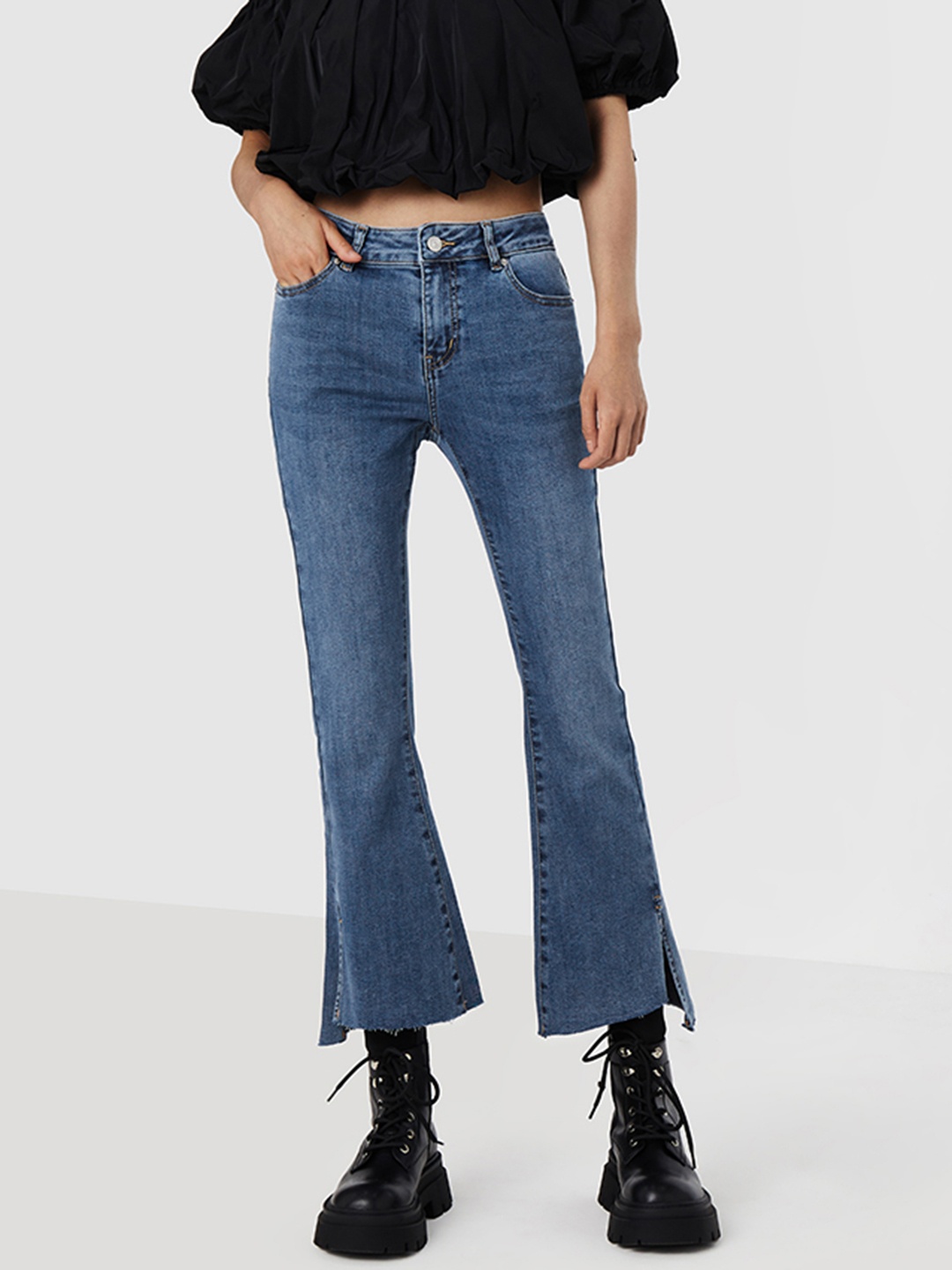 

Urban Revivo Women Slit Hem Flared High-Rise Light Fade Stretchable Jeans, Blue